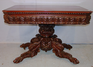 Federal mahogany acanthus carved game table with solid carving to the base top to bottom. Image courtesy of Stevens Auction Co.